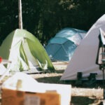 https://www.pexels.com/photo/photograph-of-tents-on-the-ground-11113247/